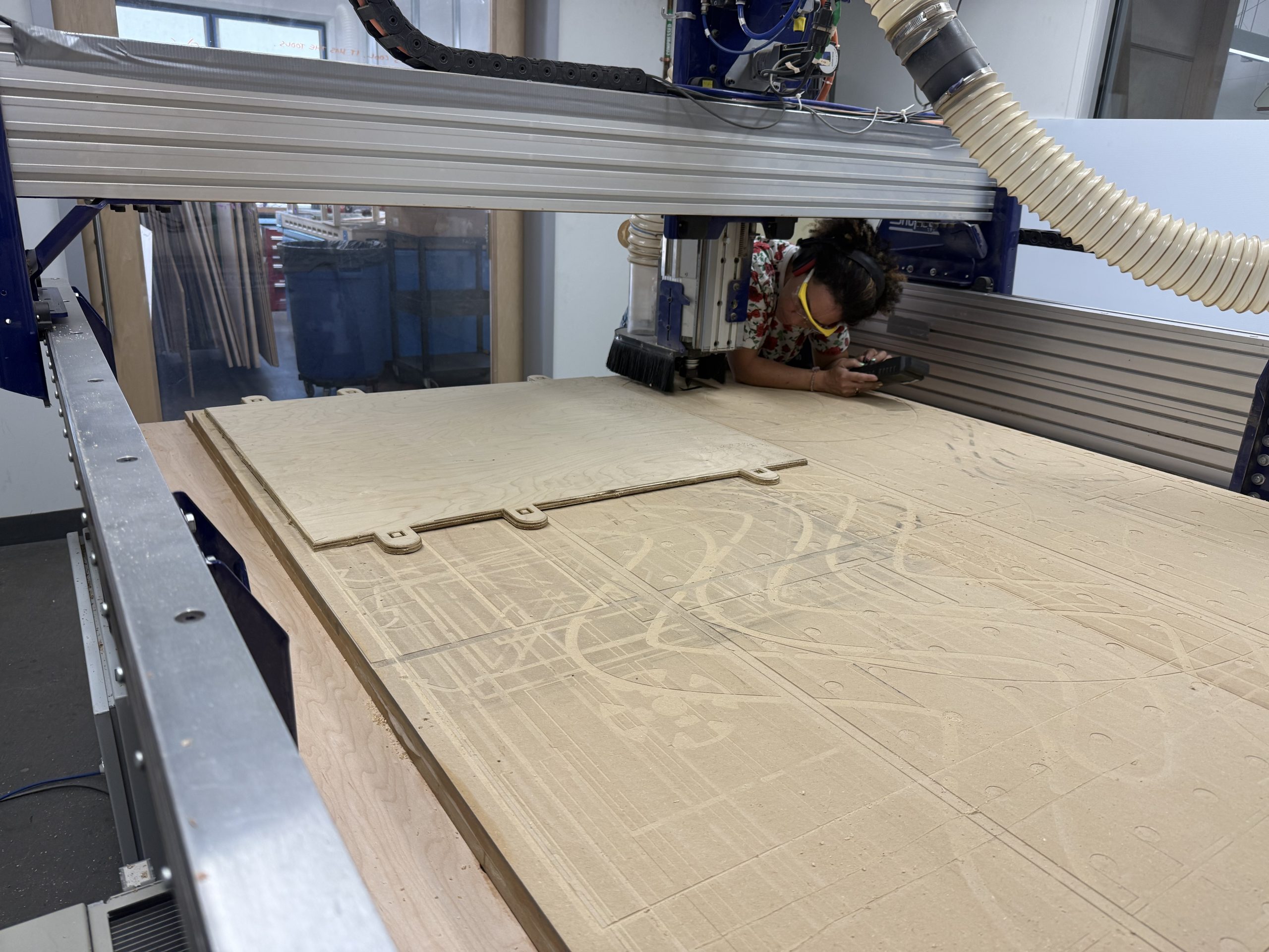 Member working on the CNC router