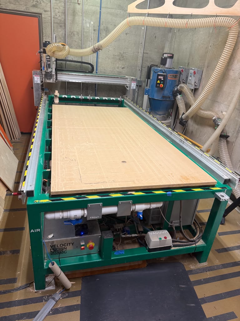 The Velocity CNC router table, with the gantry, dust collection hose, and Baileigh dust collector.